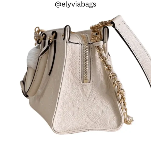 LV onthego East West Cream Side view